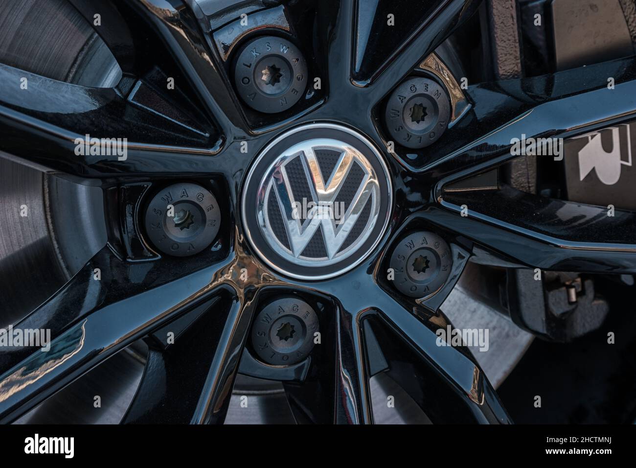 Sign of a Volkswagen logo on a car rim.. Volkswagen is the biggest German automaker and the third largest automaker in the world. Stock Photo