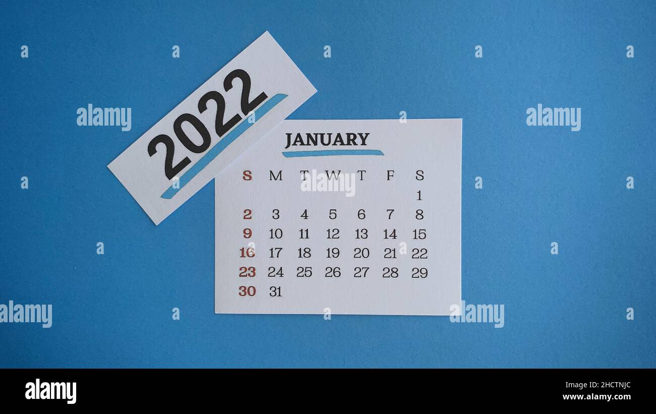 White January 2022 calendar with blue background. 2022 New Year Concept Stock Photo