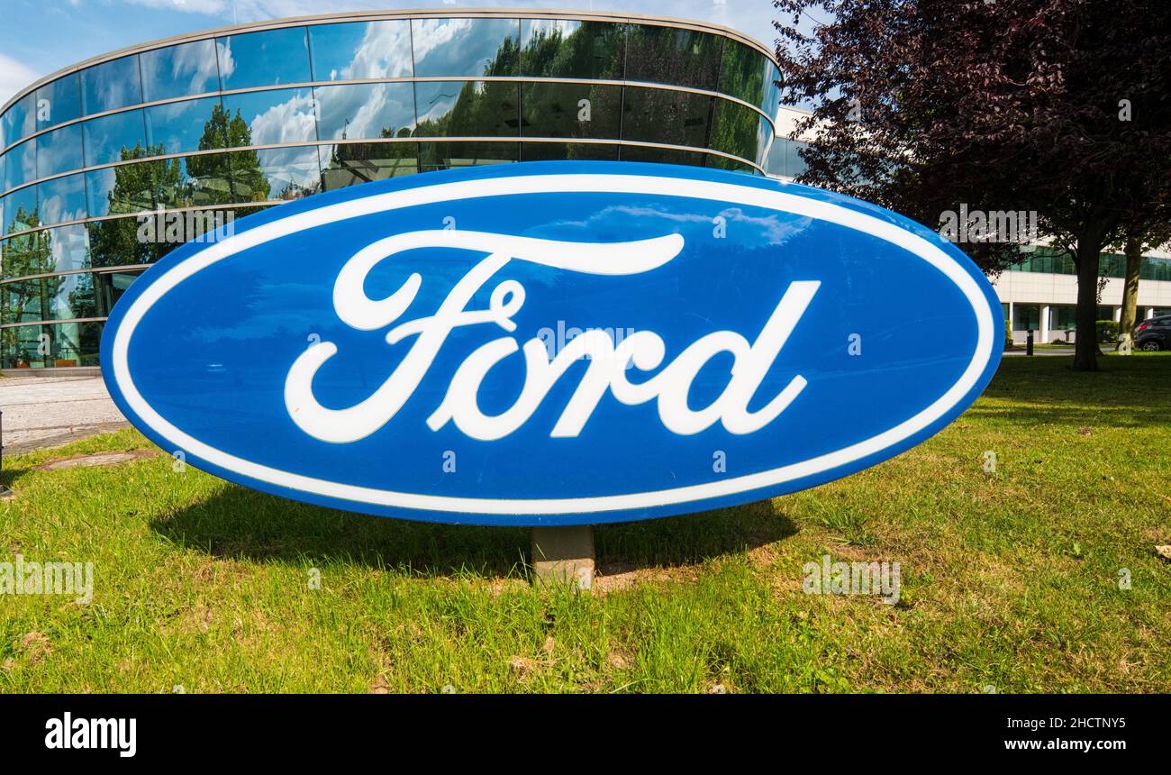 Ford logo on a dealership's building. The Ford Motor Company is an