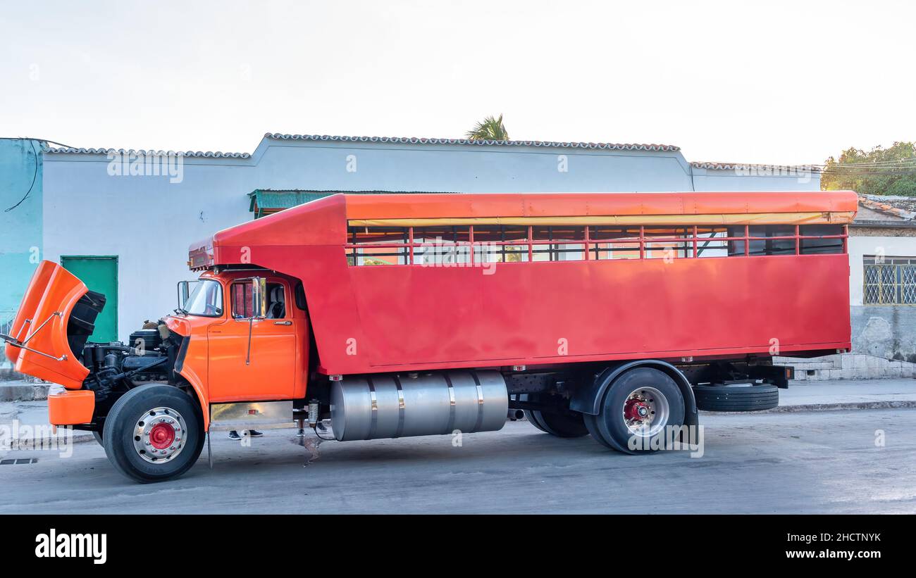 A broken passenger transportation vintage truck. The vehicle has an open hood.  Jan. 1, 2021 Stock Photo