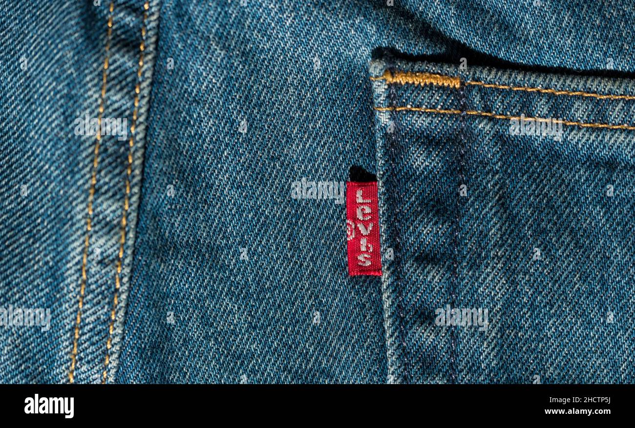 Close up of the LEVI'S label on a blue jeans. LEVI'S is a brand name of ...
