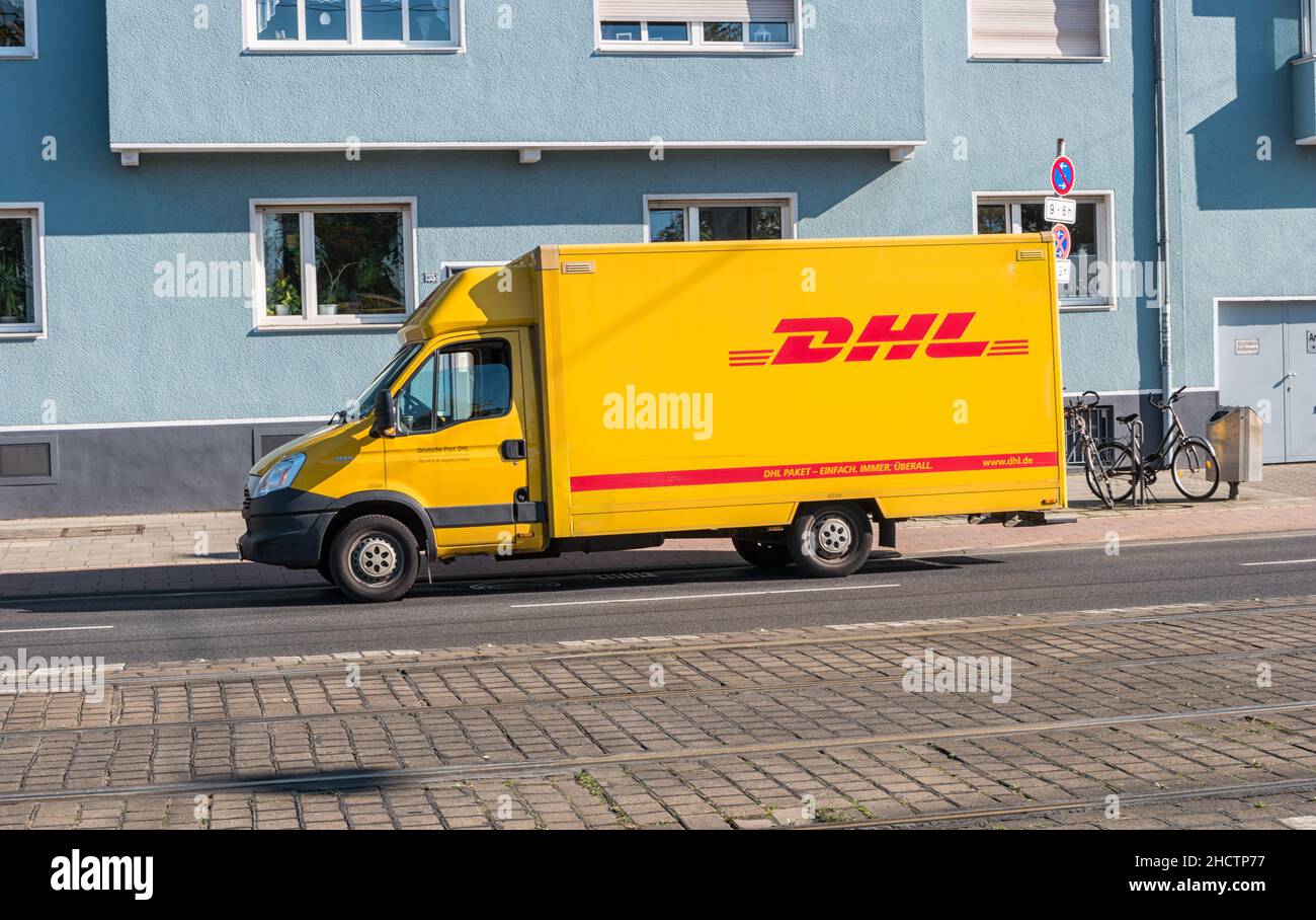 Yellow DHL parcel delivery truck on the street. DHL Express is a division of the German worldwide logistics company Stock Photo - Alamy
