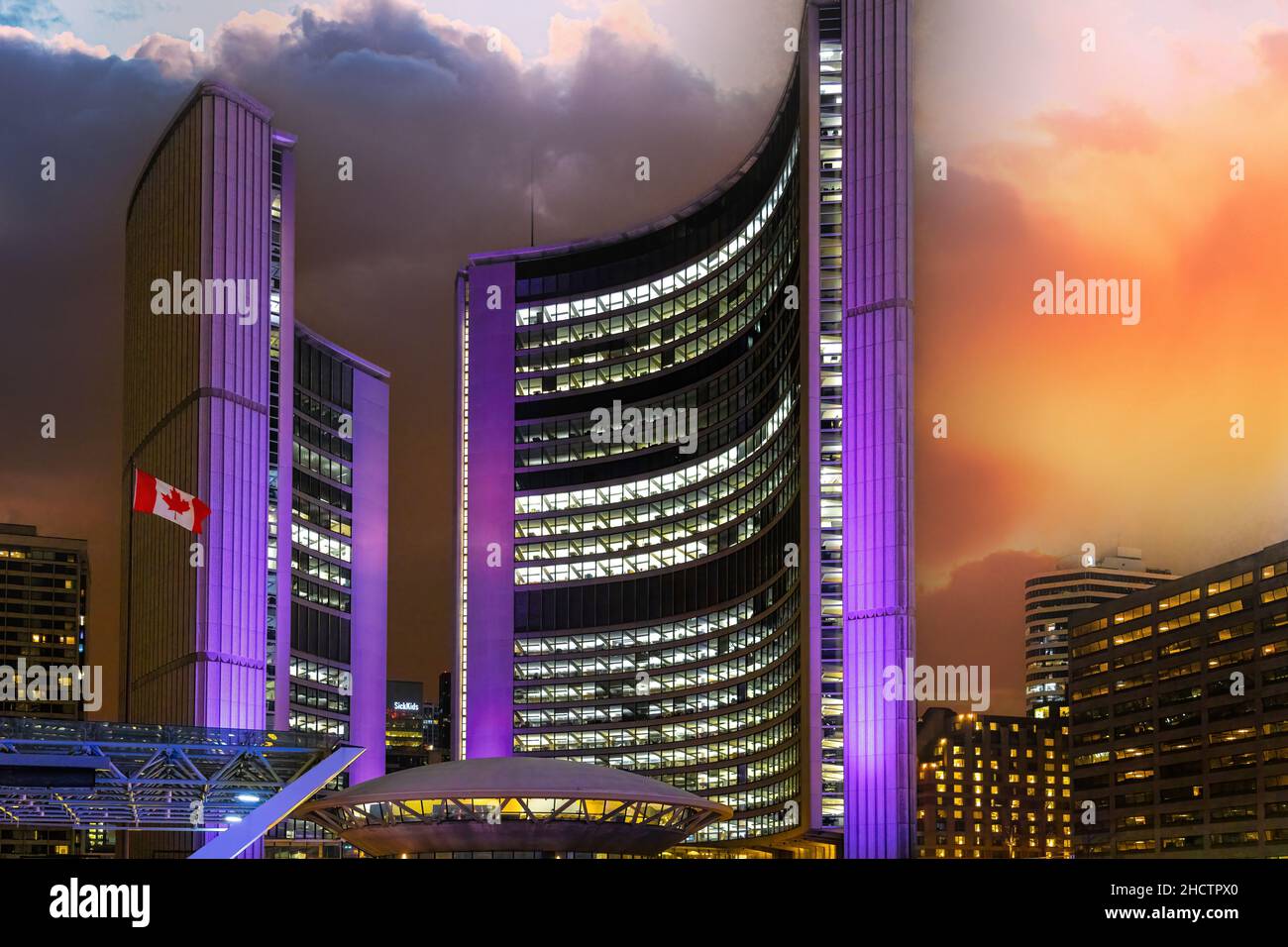 The new city hall or town hall illuminated in purple. The famous building is located in Nathan Phillips Square.  Dec. 29, 2021 Stock Photo