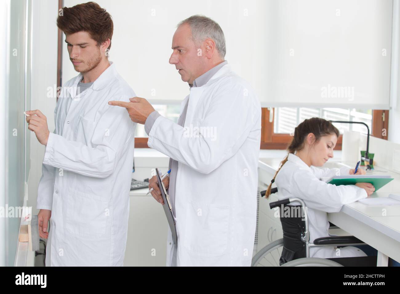 the students in white coats Stock Photo Alamy