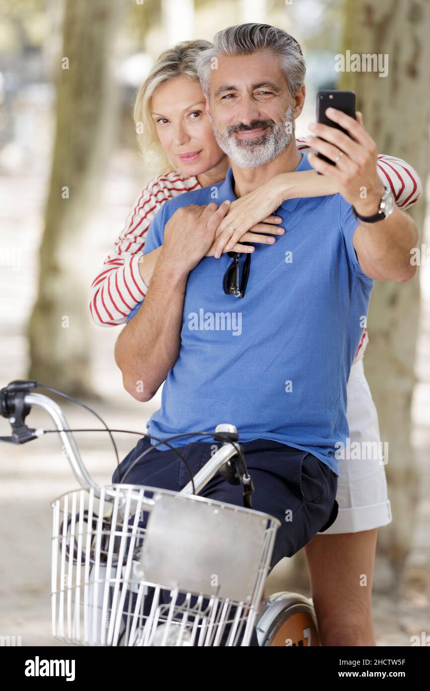 mature couple taking selfie outdoors Stock Photo