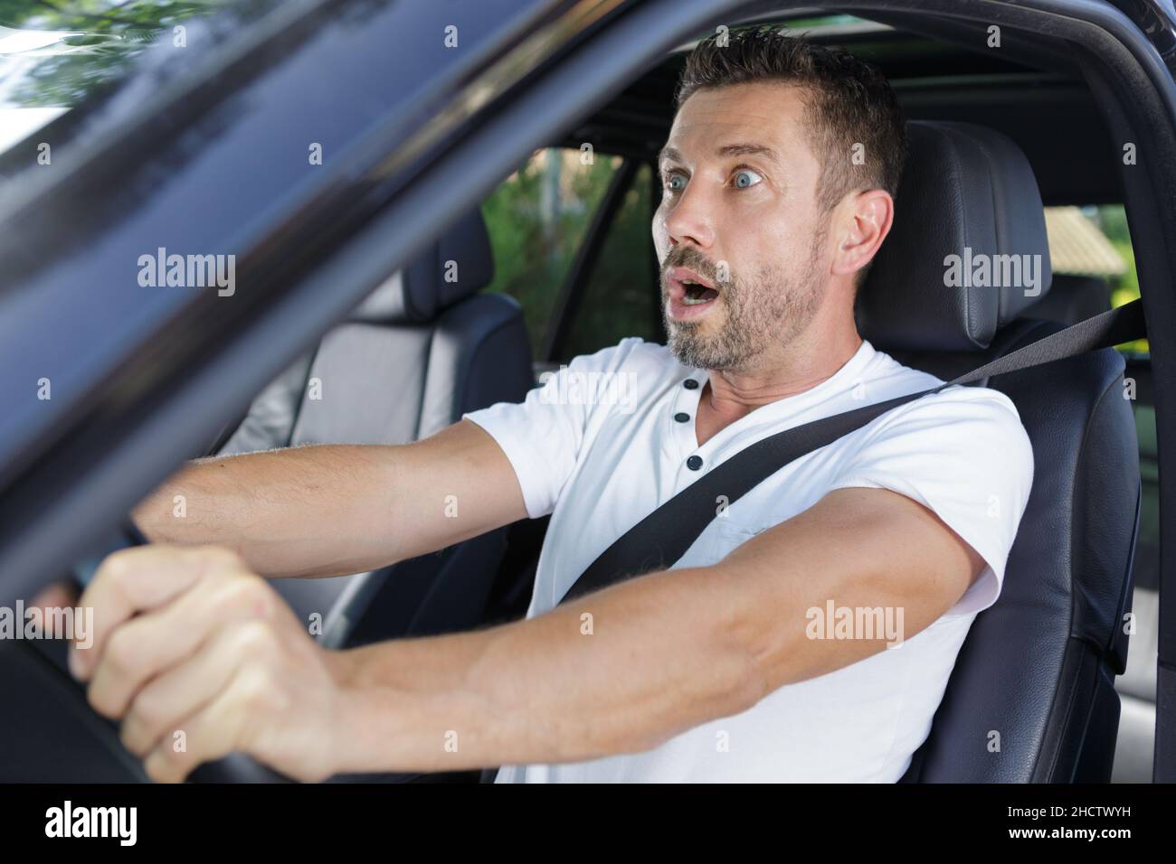 shocked driver in the car Stock Photo Alamy