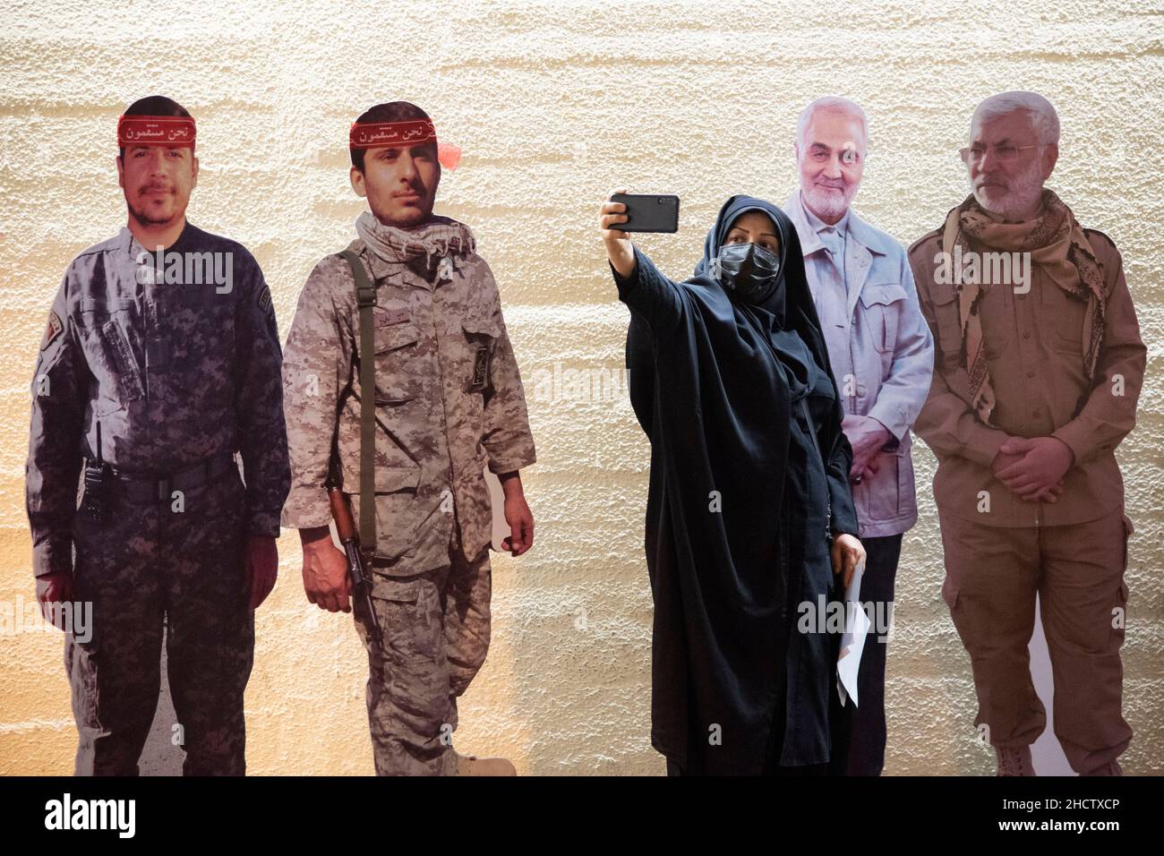 Tehran, Iran. 01st Jan, 2022. A woman taking a selfie with effigies of the Iranian former commander of the Islamic Revolutionary Guard Corps (IRGC) Quds Force, General Qasem Soleimani, and the Iraqi commander of the Popular Mobilisation Forces (PMF) Abu Mahdi al-Muhandis during the gathering of Qasem Soleimani's supporters. the Iranian former Islamic Revolutionary Guard Corps (IRGC) Quds Force General Qasem Soleimani was killed in an American drone attack in Baghdad airport. (Photo by Sobhan Farajvan/Pacific Press) Credit: Pacific Press Media Production Corp./Alamy Live News Stock Photo
