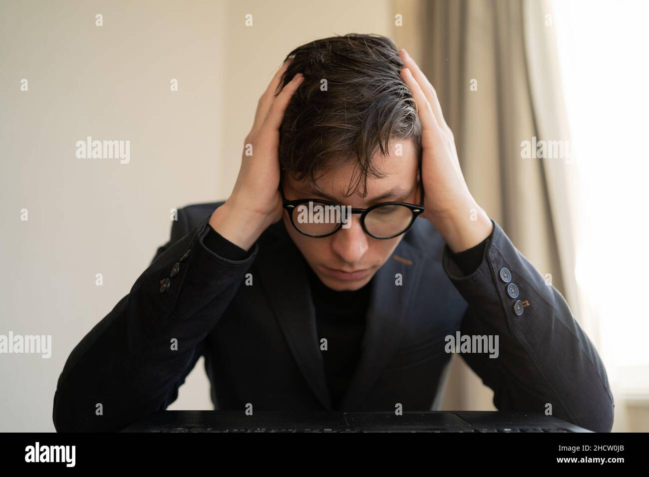 portrait of stressed business man in the office. bad awful negative news got fired from work. Dismissal notice, financial problems. Stock Photo