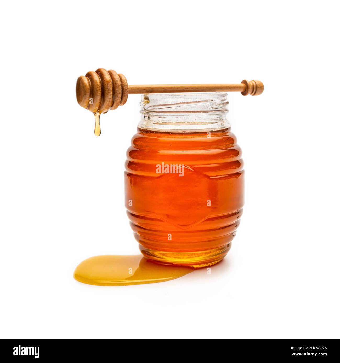 Honey pot and dipper isolated on white background Stock Photo Alamy