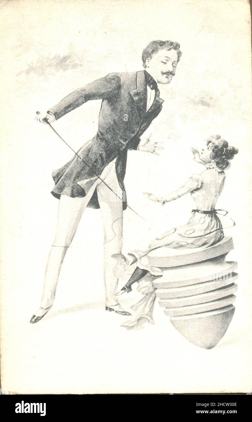 Picture postcard showing domineering man taking whip to woman seated on spinning top circa 1903 Stock Photo