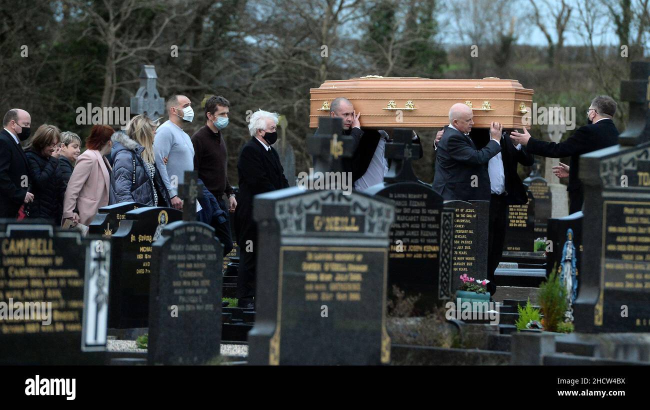 The coffin of Peter (Petey) McNamee being carried in the graveyard the