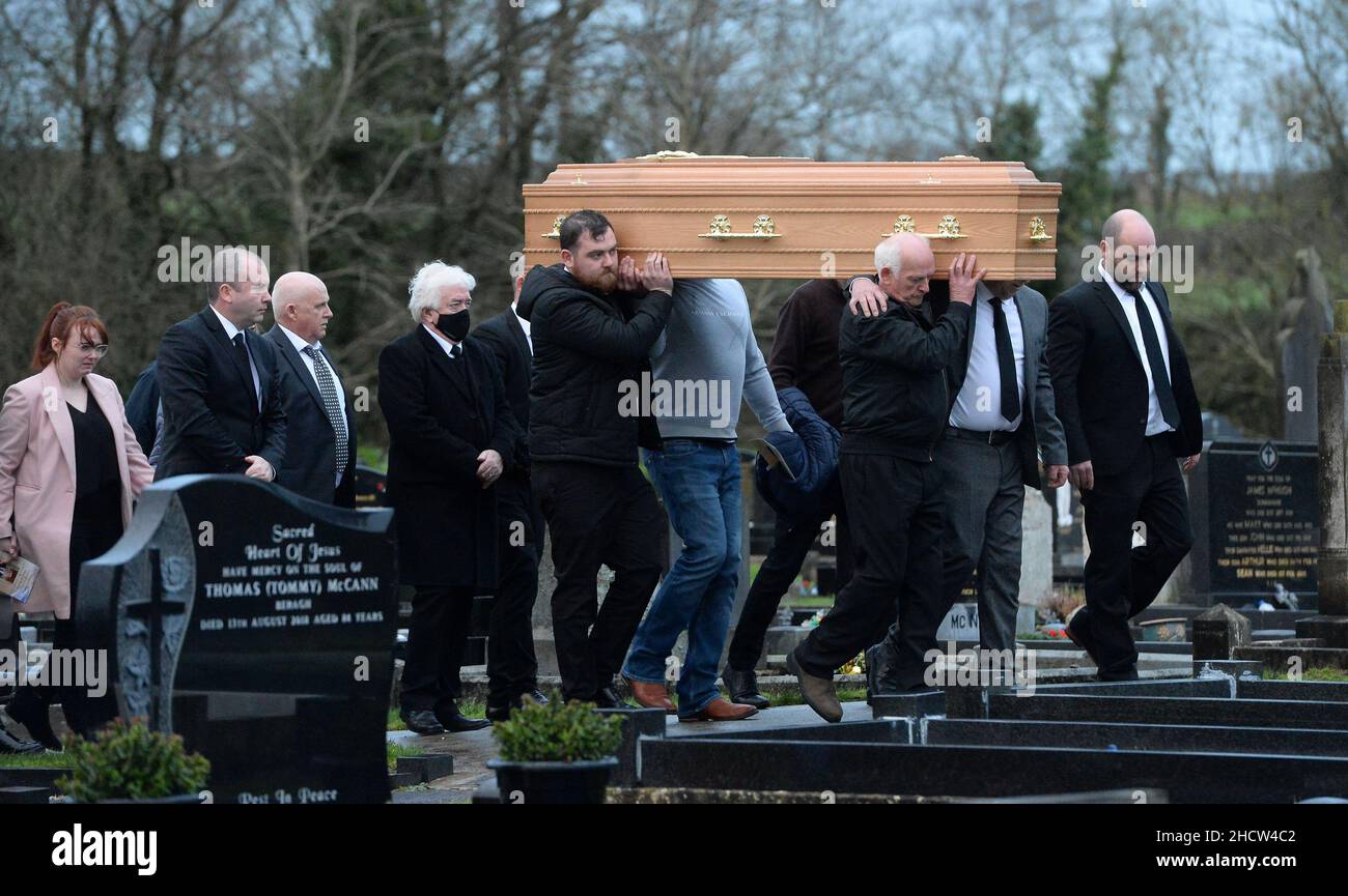 The coffin of Peter (Petey) McNamee being carried in the graveyard the