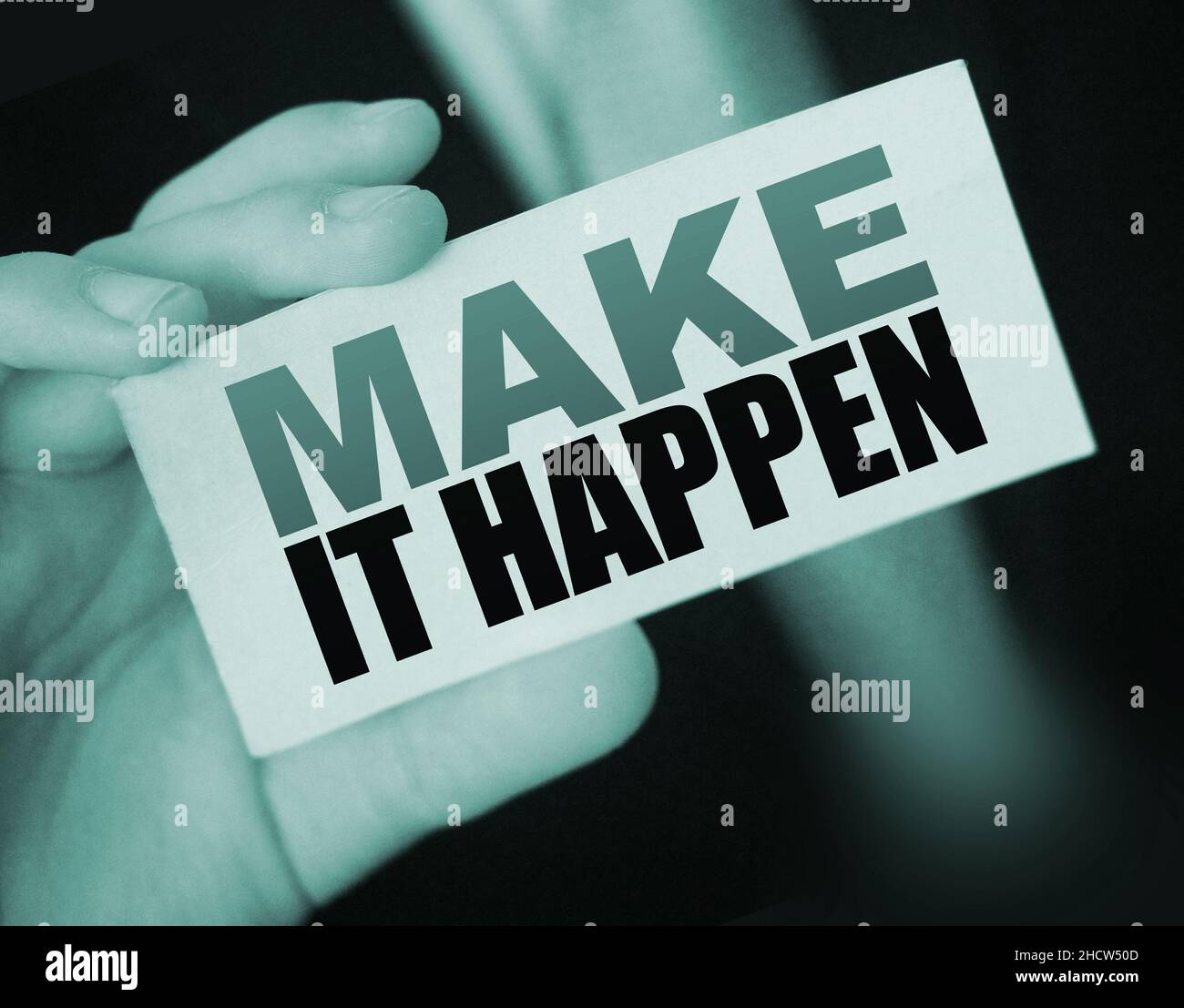 Make It Happen card in businessman hand. Business concept Stock Photo