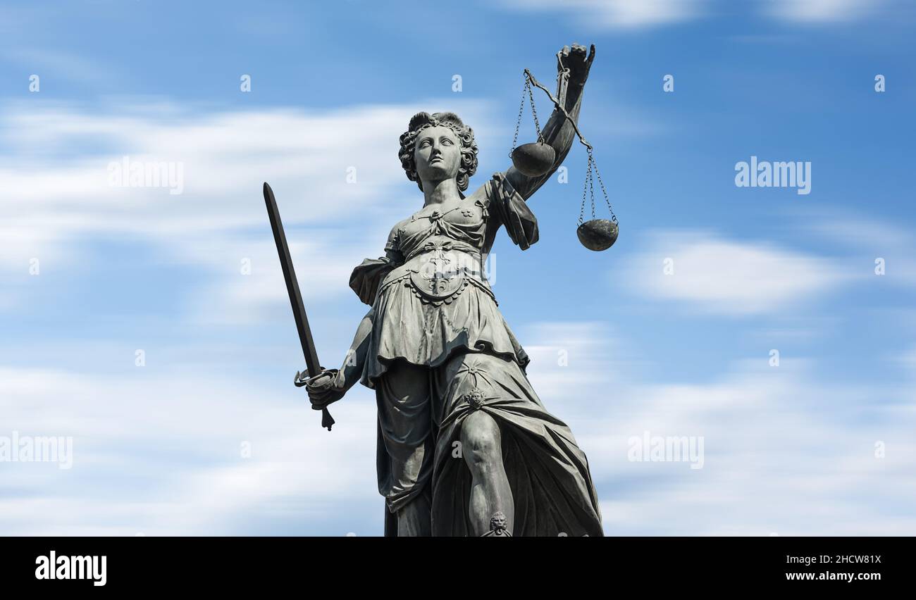 Justitia Clean Justitia on blue sky Stock Photo - Alamy