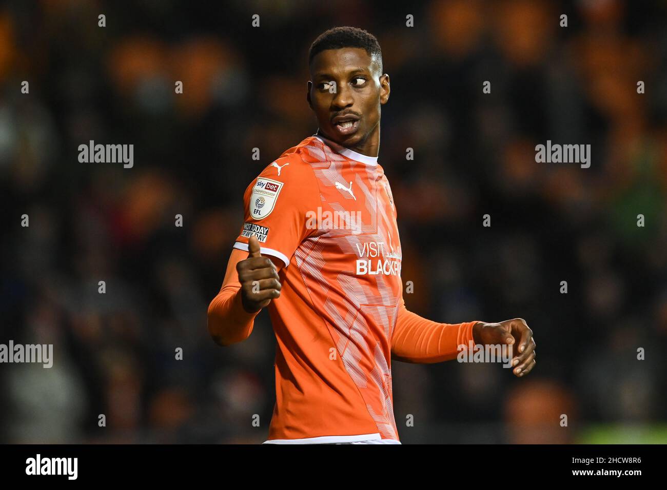 Marvin Ekpiteta #21 of Blackpool gives the thumbs up to team mates ...