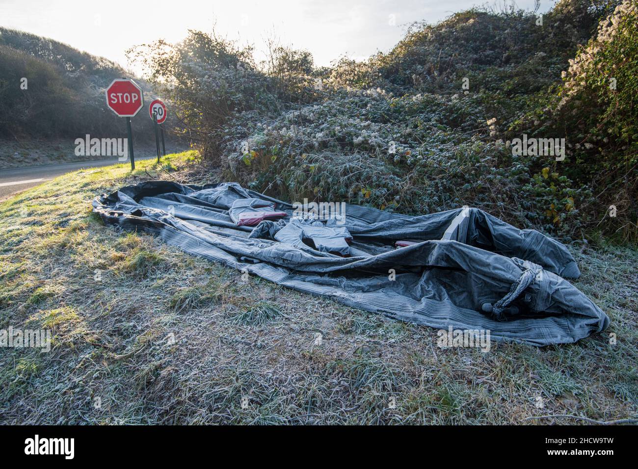 Ambleteuse, France - December 22, 2021 : inflatable boat and life jacket abandoned by migrants wishing to cross the Channel. Stock Photo