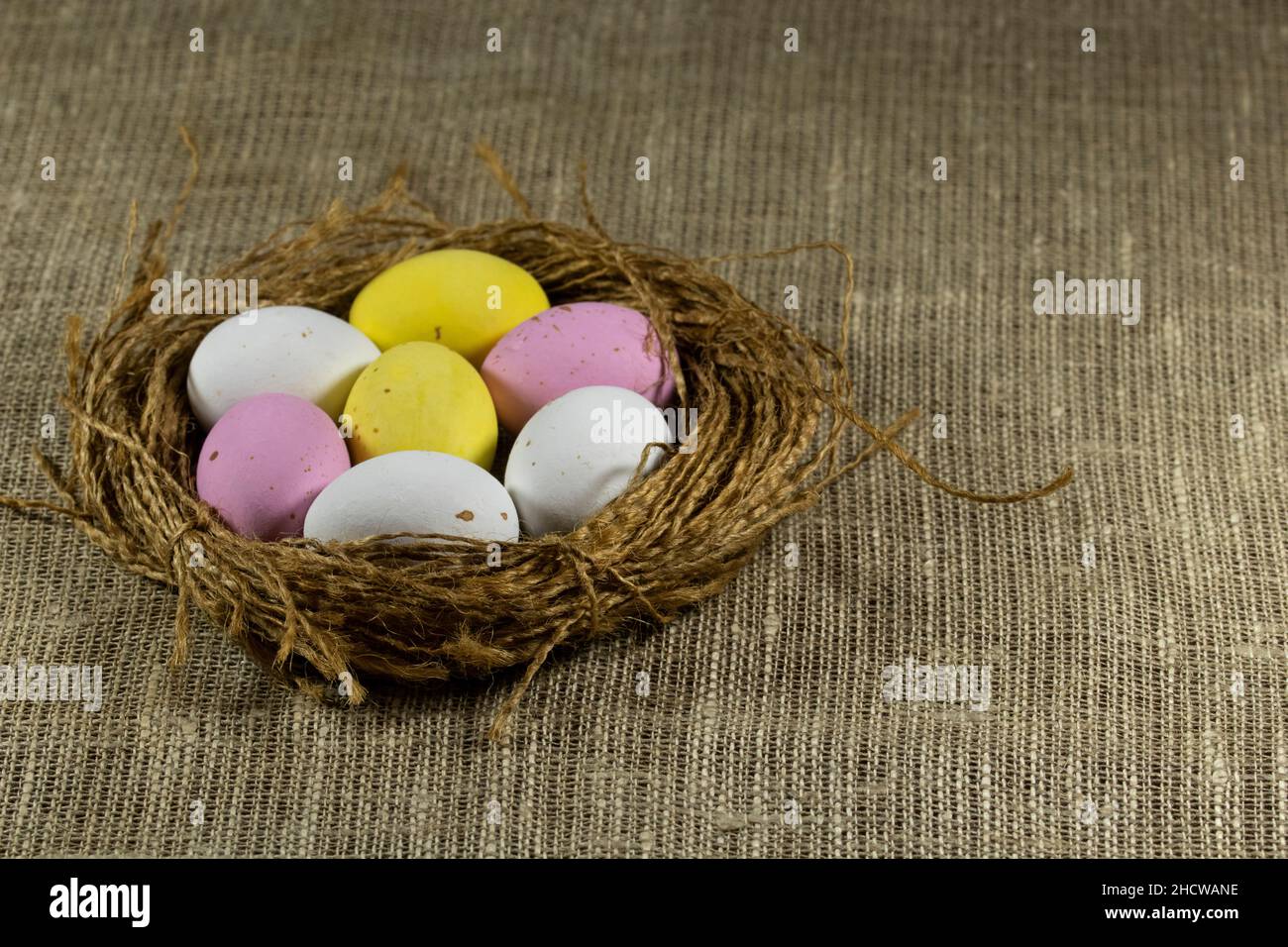 Nest with colorful Easter eggs. Stock Photo