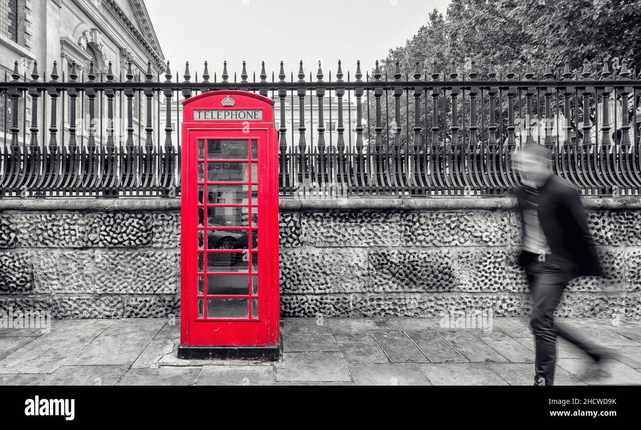 red telephone booth on street in London Stock Photo - Alamy
