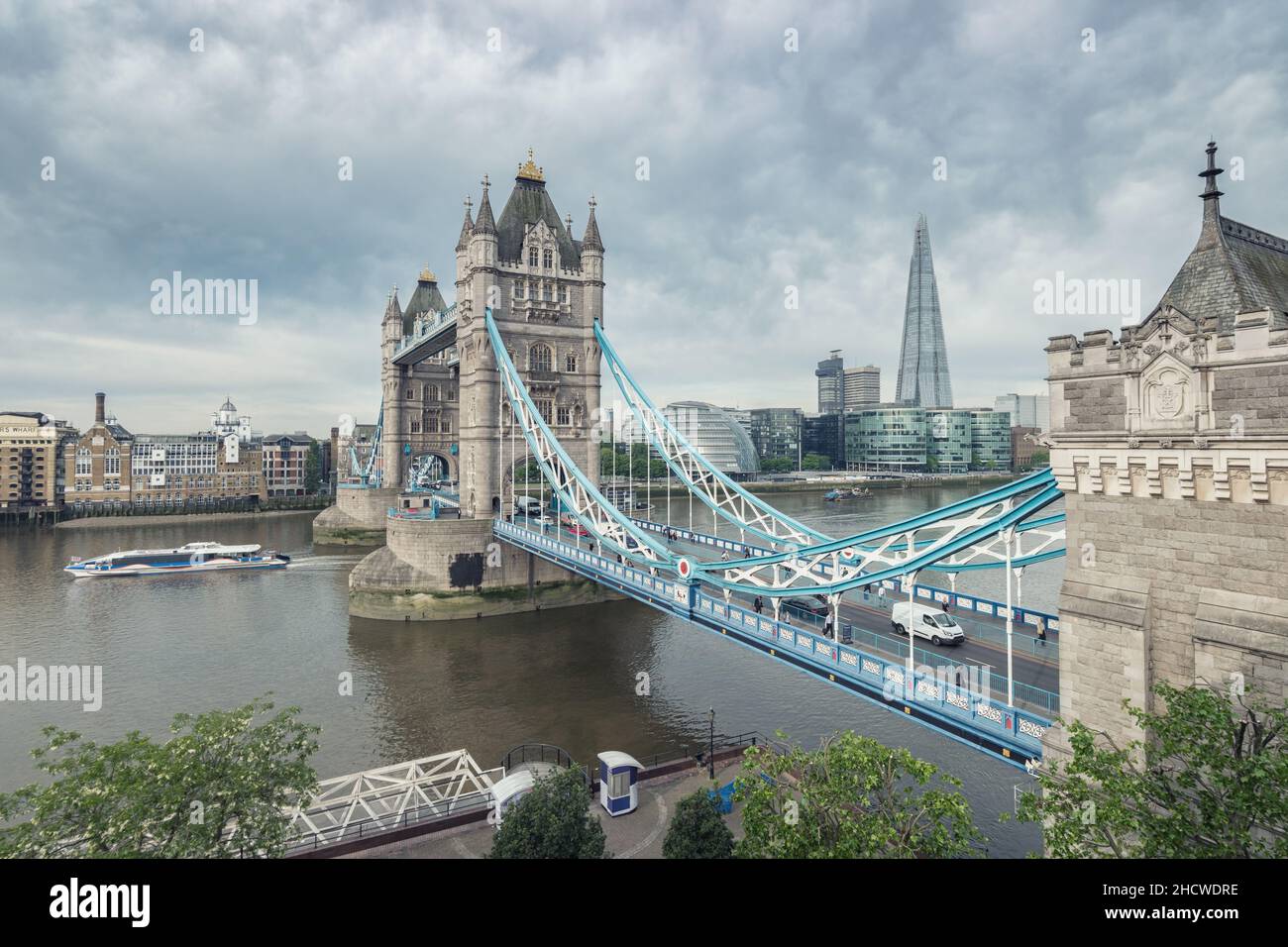 Tower bridge and London city hall with dramatic clouds, UK Stock Photo ...
