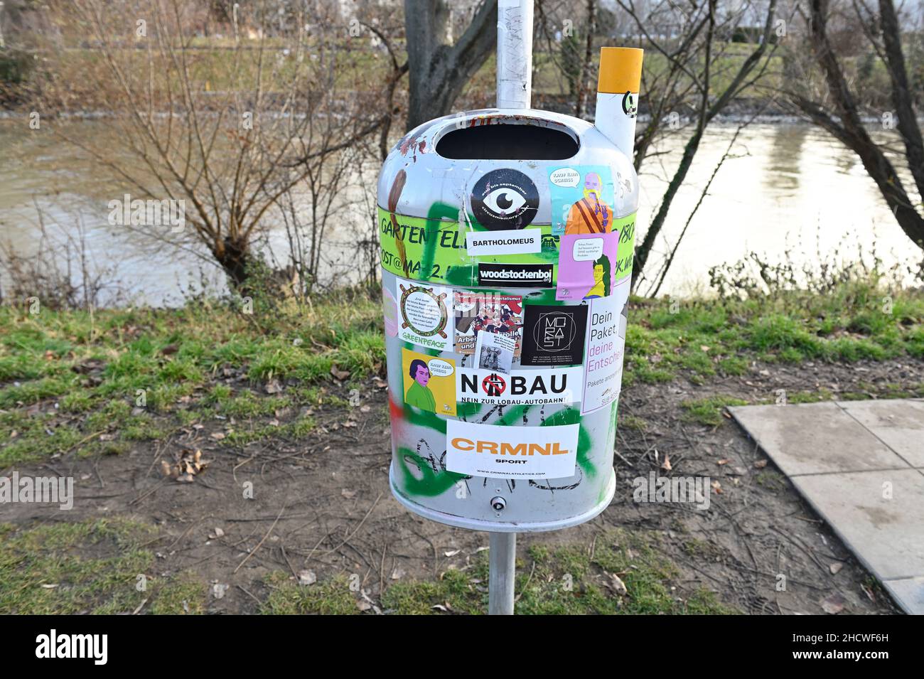 Vienna, Austria. Trash can with lots of stickers on the Danube Canal Stock Photo