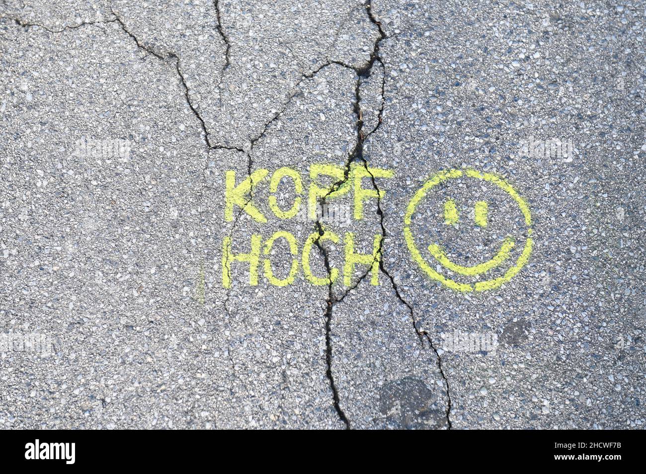Cheer up graffiti with smiley on the asphalt Stock Photo