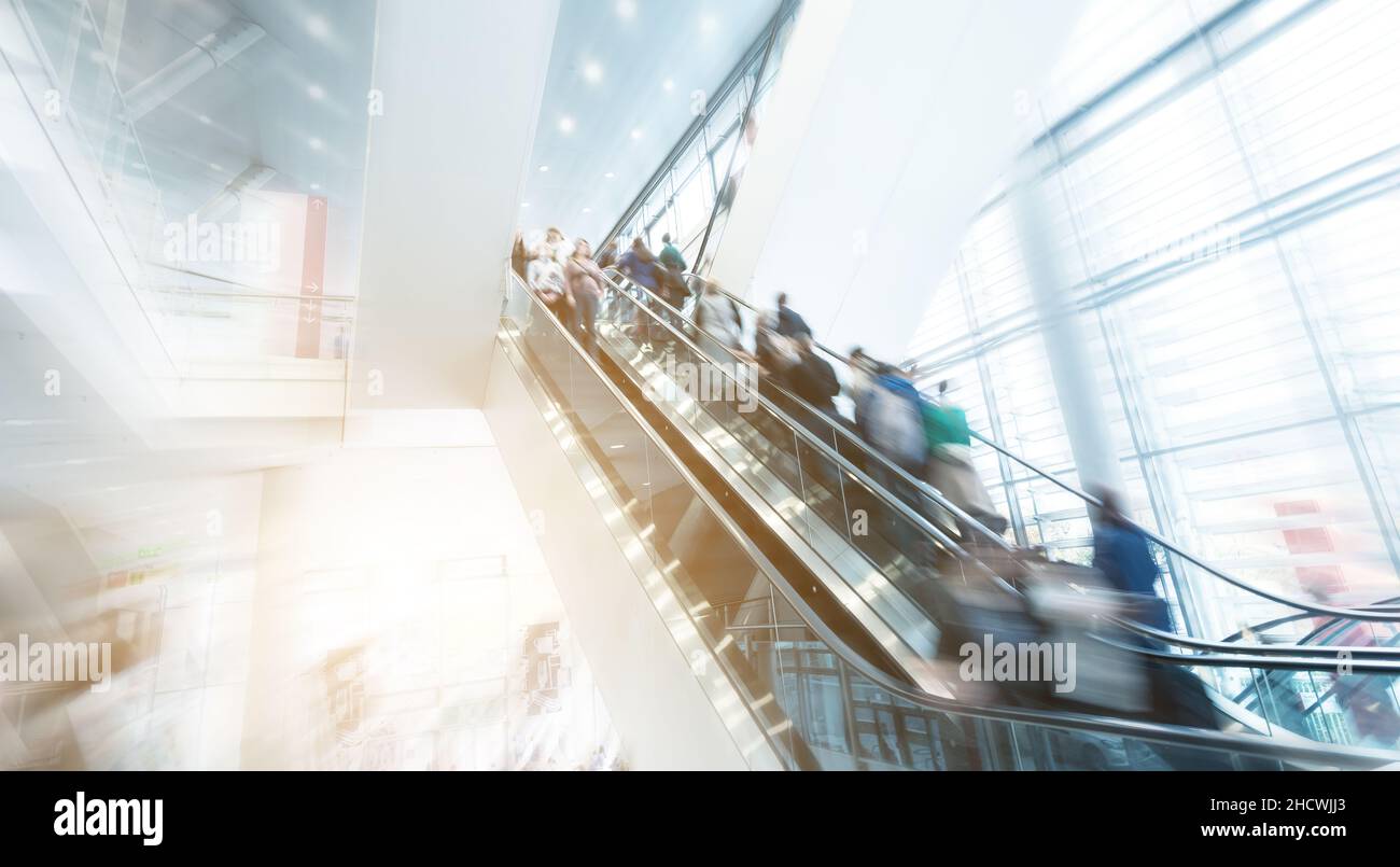 abstrakt image of people at escalators motion blur Stock Photo