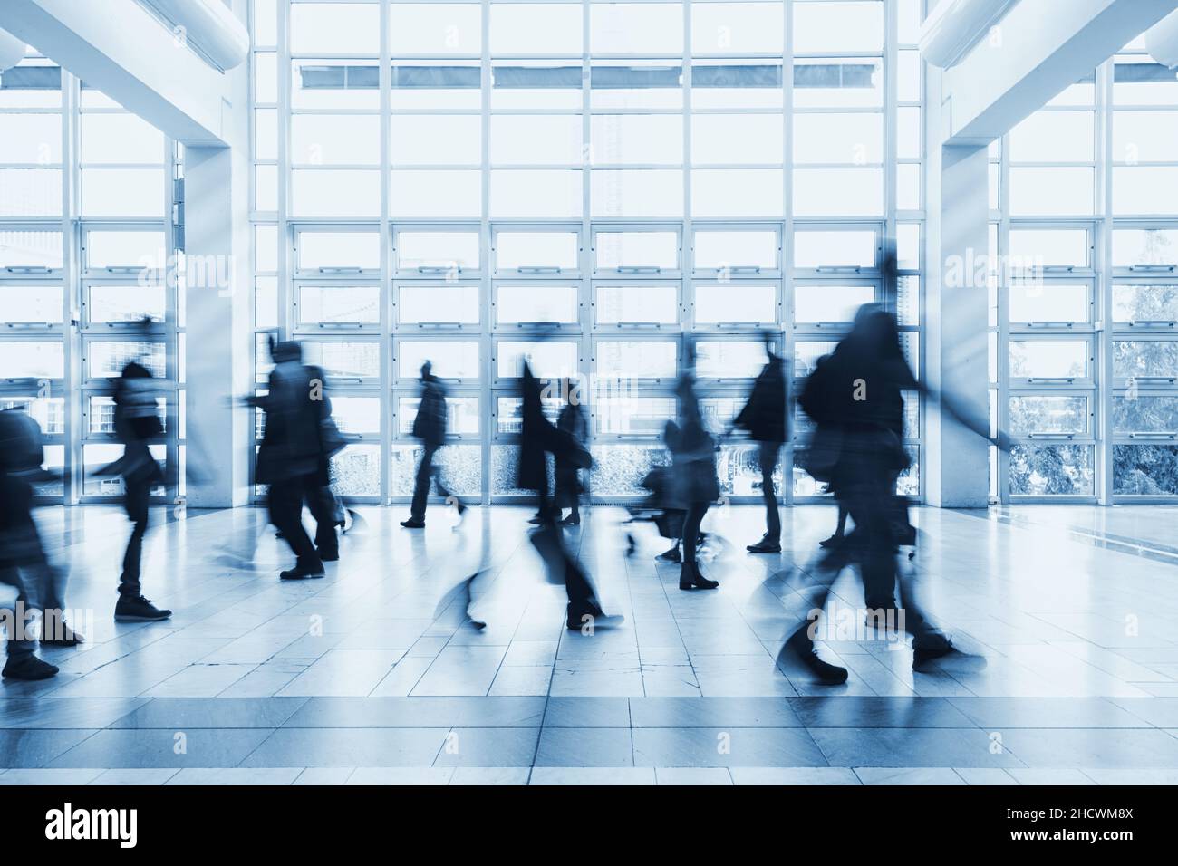 Blurred people walking in a modern environment Stock Photo - Alamy