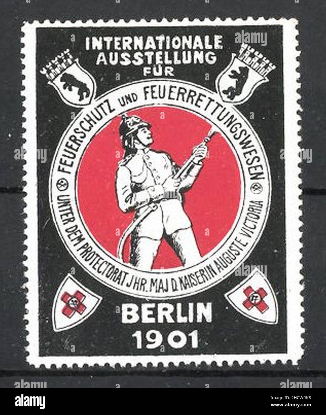 Reklamemarke-Berlin-Int-Ausstellung-fuer-Feuerschutz-und-Feuerrettungswesen-1901-Feuerwehrmann-mit-Spritze-beim-Loeschen. Stock Photo