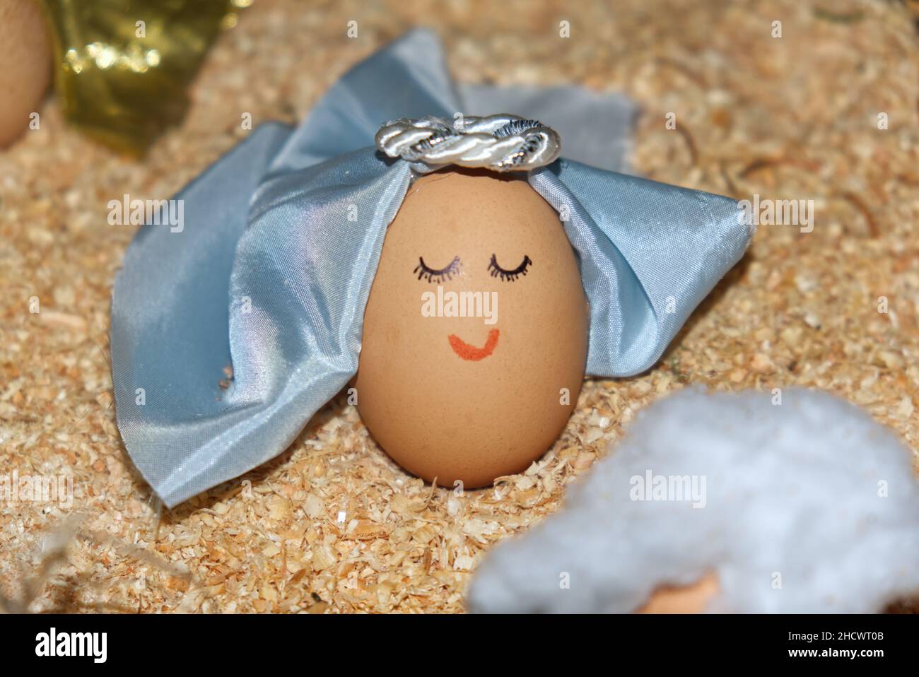 funny anthropized egg with angel face and virgin veil Stock Photo