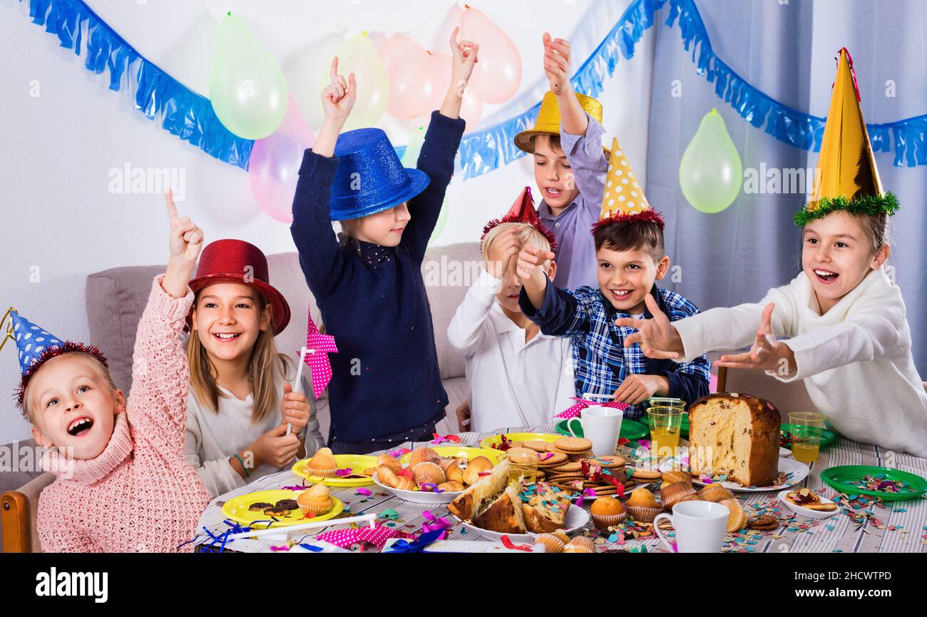 Boys and girls behaving jokingly during friend’s birthday party Stock ...