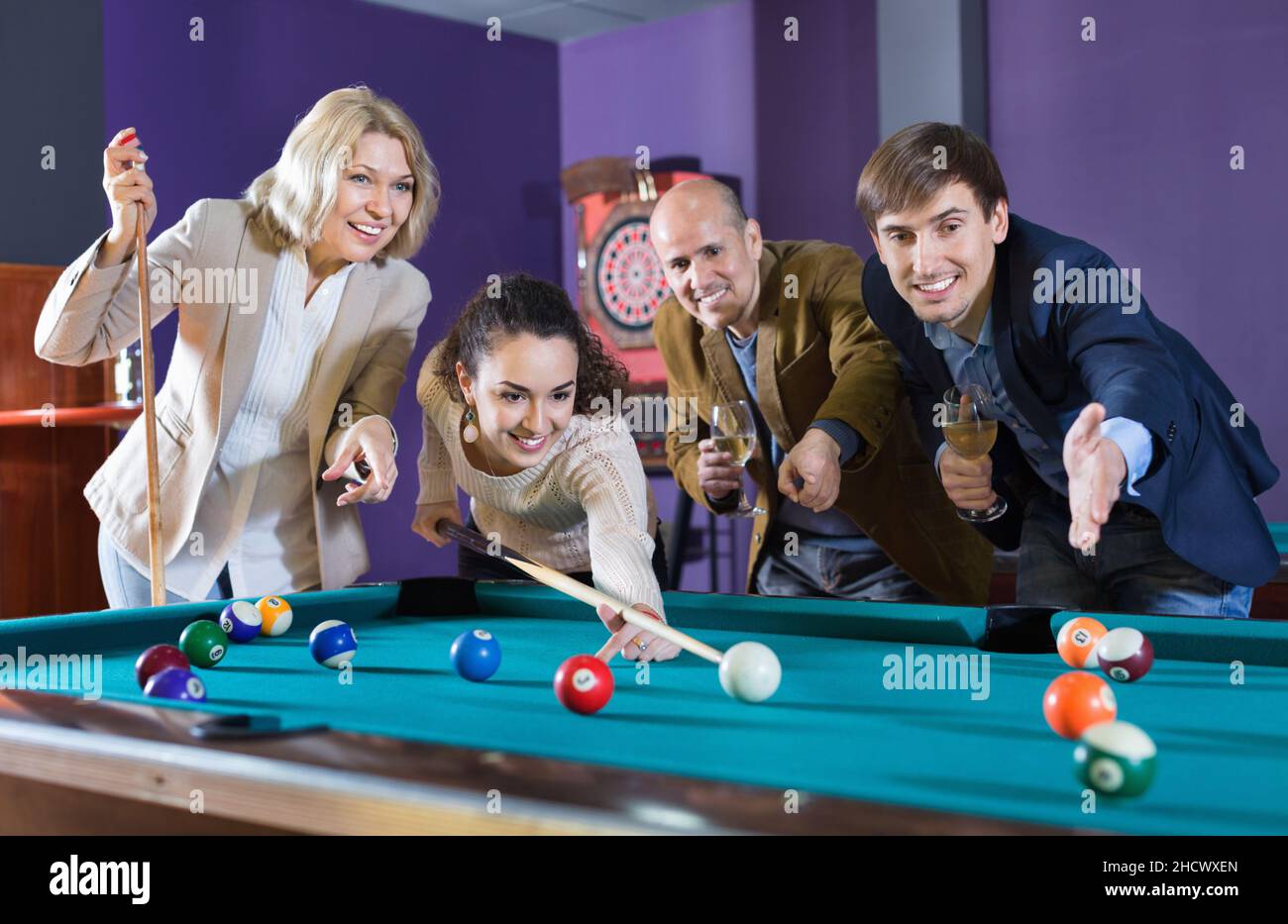Group Of Friends Play Billiards At Night Out Stock Photo - Download Image  Now - Snooker, Adult, Adults Only - iStock