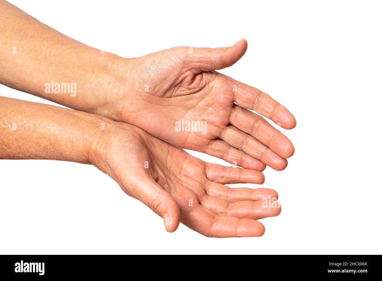 Old wrinkled palms of an elderly woman extending forward, a woman begs