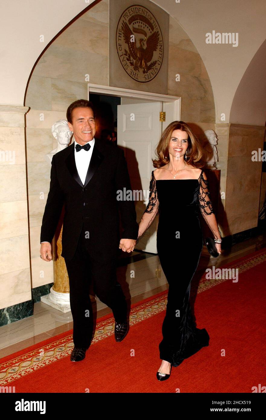 Washington, DC - February 22, 2004 -- California Governor Arnold Schwarzenegger and his wife, Maria Shriver, arrive at the White House in Washington, DC on February 22, 2004.  They were attending the 2004 National Governors Association Dinner with United States President George W. Bush..Credit: Ron Sachs / CNP Stock Photo