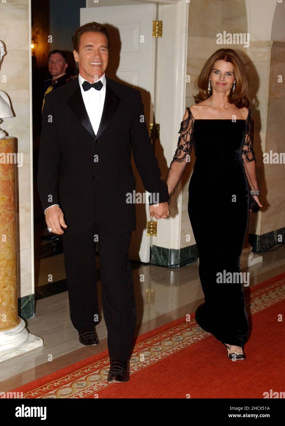 Washington, DC - February 22, 2004 -- California Governor Arnold Schwarzenegger and his wife, Maria Shriver, arrive at the White House in Washington, DC on February 22, 2004.  They were attending the 2004 National Governors Association Dinner with United States President George W. Bush..Credit: Ron Sachs / CNP Stock Photo