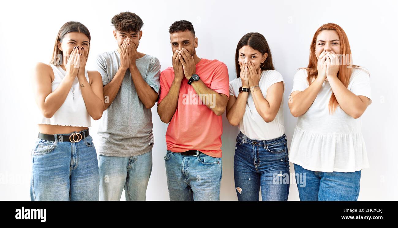 Embarrass Friend Group of young friends standing together over isolated background ...