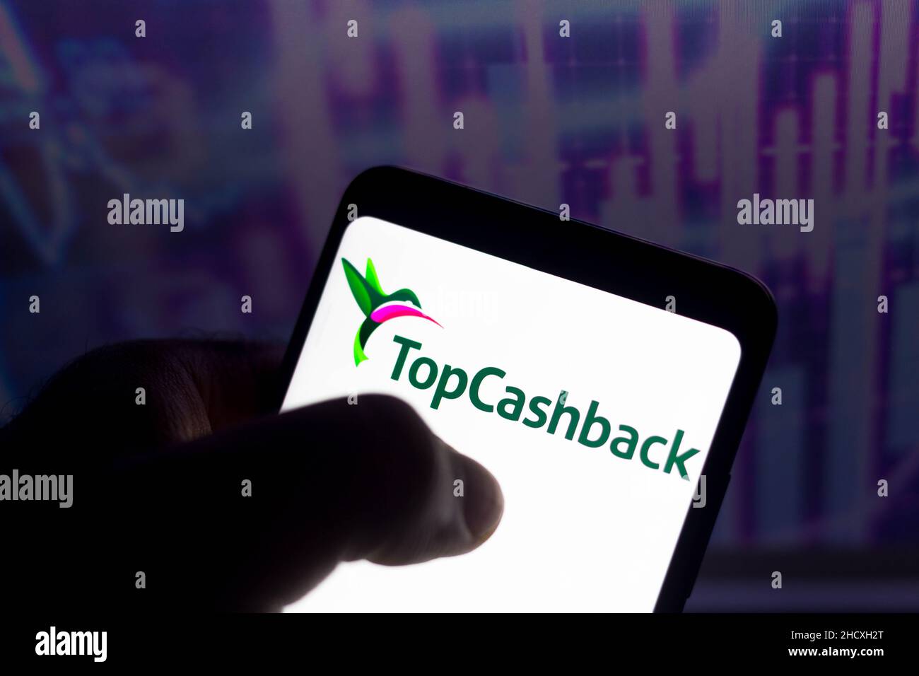 In this photo illustration, the TopCashback logo seen displayed on a ...