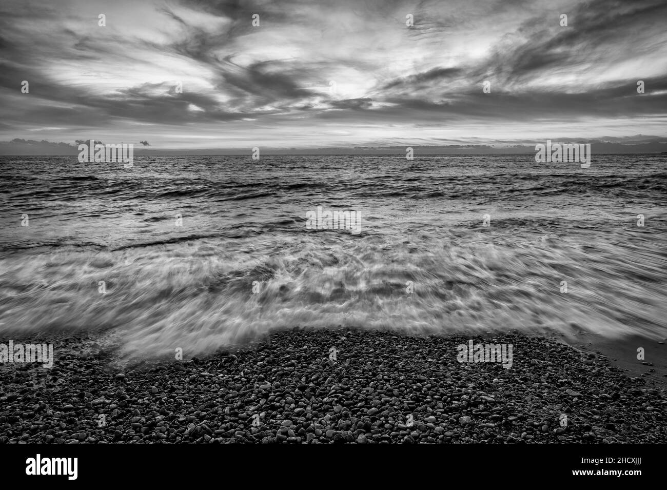 An Ocean Seascape Sunset Sky With A Detailed Cloudscape As A Wave ...