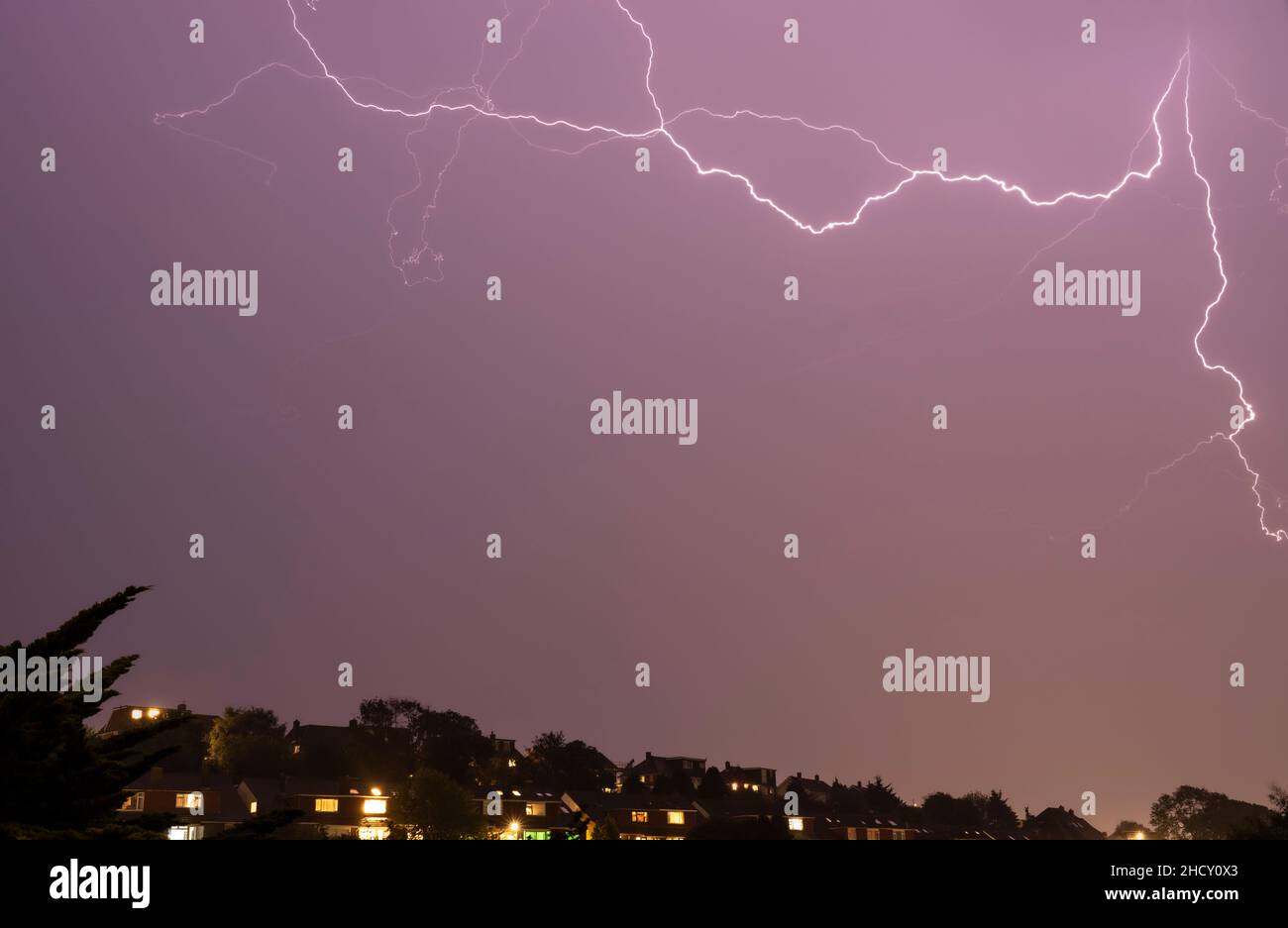 fork lightning in sky over city Stock Photo