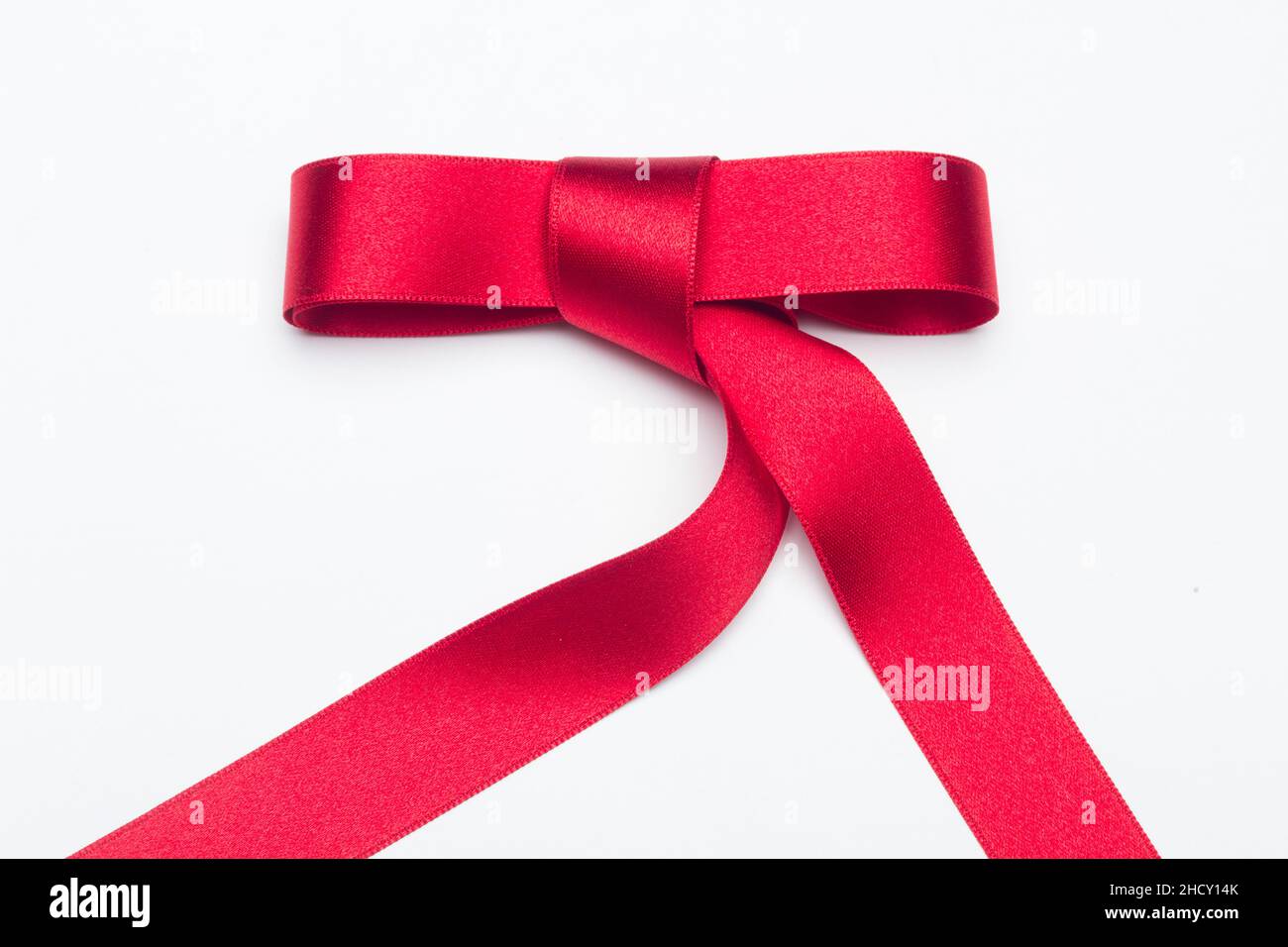 Wrapping Red Riboon Red ribbon for gift wrapping on a white background Stock Photo - Alamy