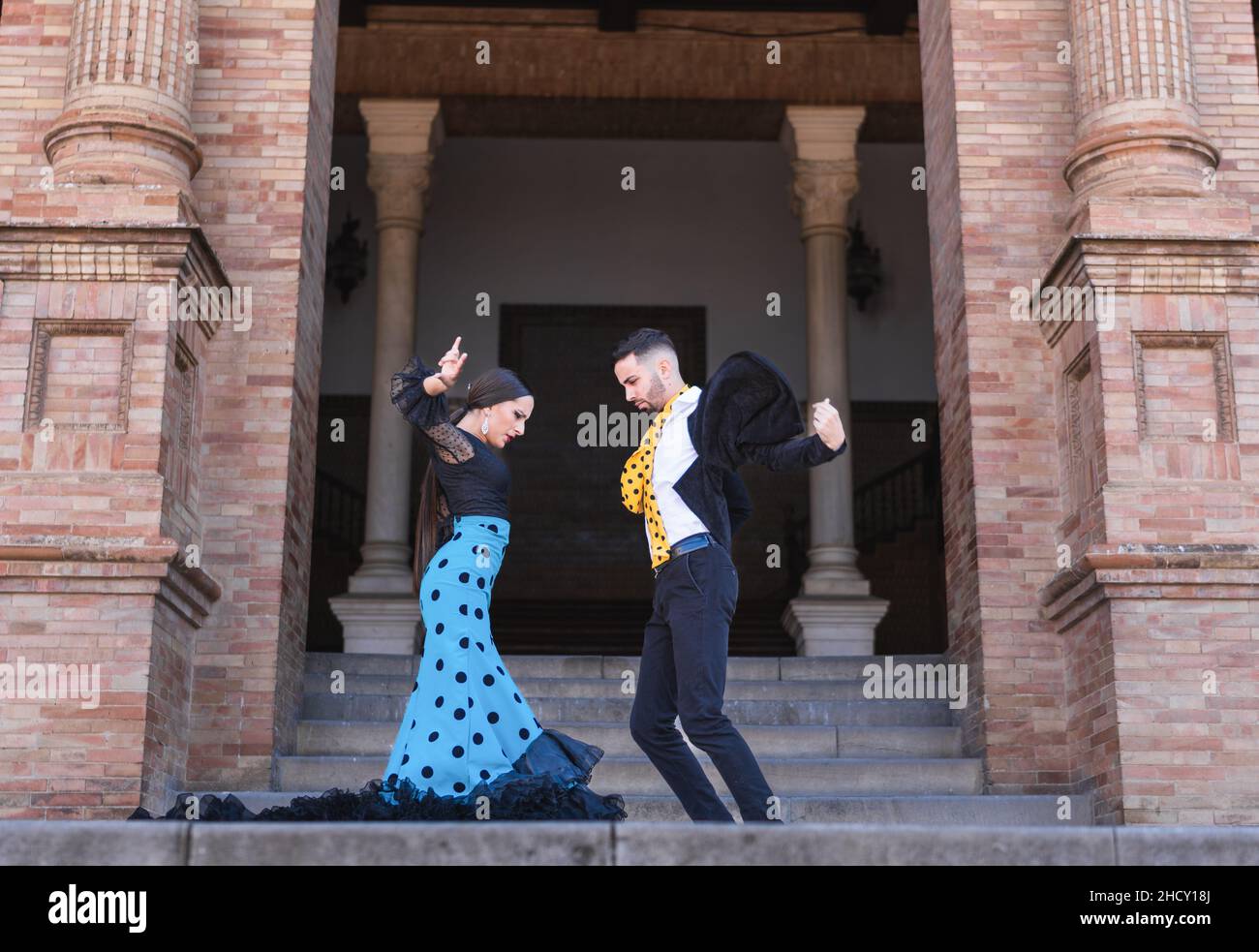 Two flamenco dancers performing in stairs of a building Stock Photo