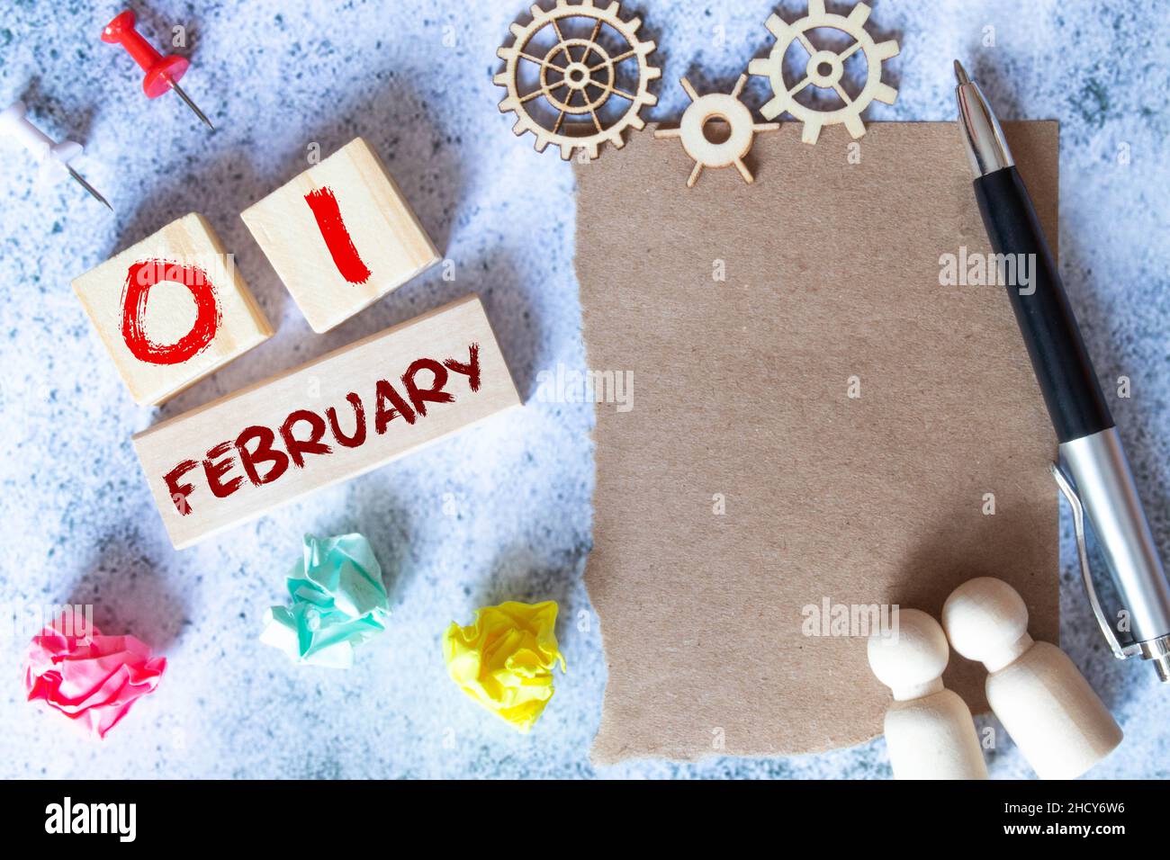 February 1. Day 1 of month, Cube calendar with date, empty frame on light blue background. Place for your text. Winter month, day of the year concept. Stock Photo