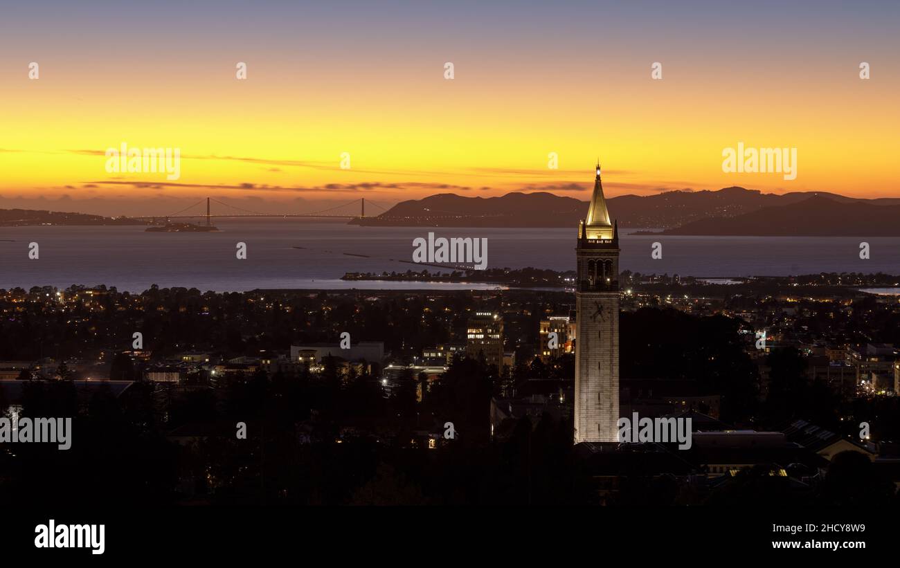 Twilight skies over Sather Tower, (a.k.a. the Campanile) of UC Berkeley via Big C Trail. Berkeley, Alameda County, California, USA. Stock Photo