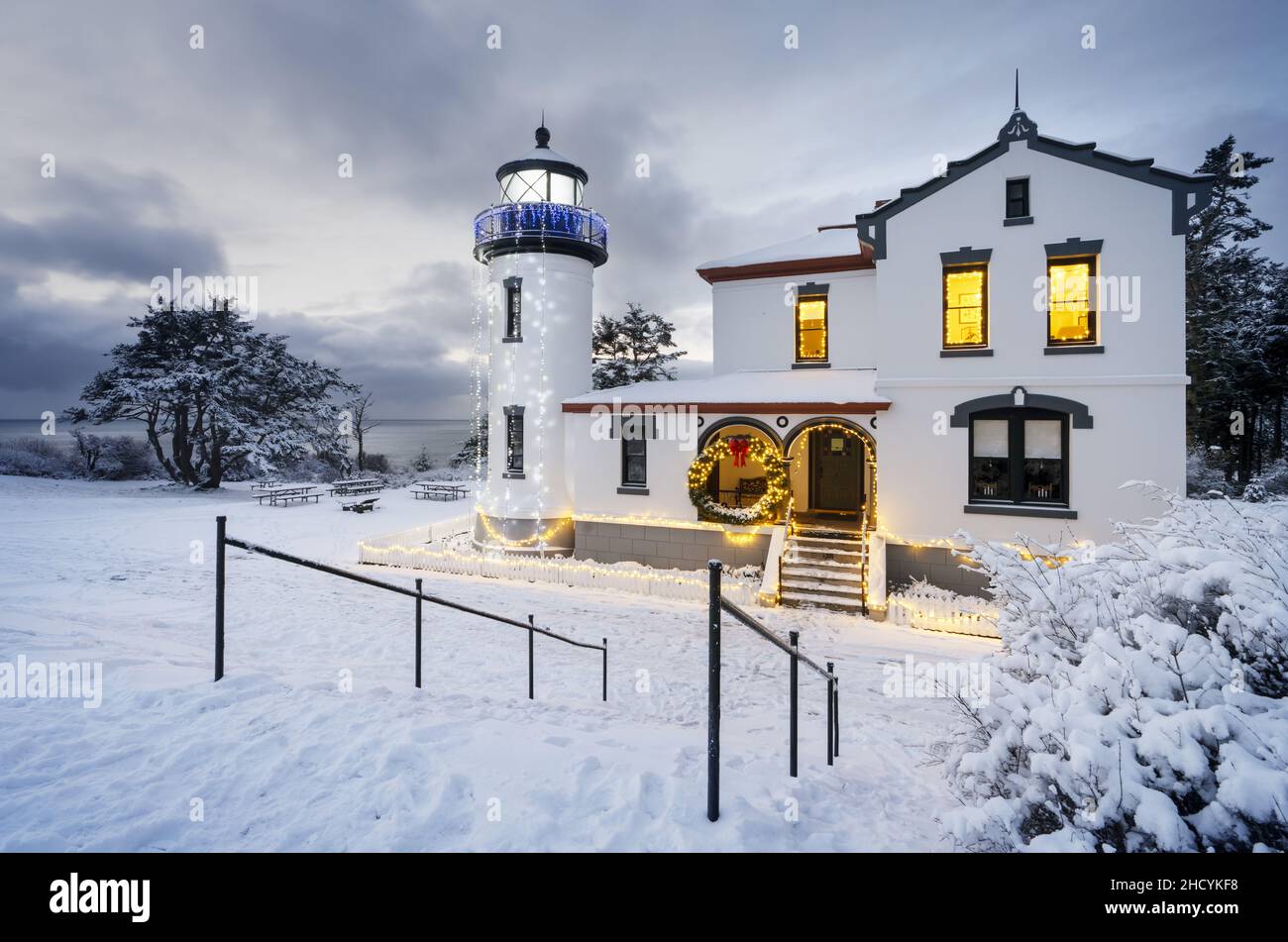 Admiralty Head Lighthouse in snow decorated for Christmas, Fort Casey State Park, Whidbey Island, Island County, Washington, USA Stock Photo