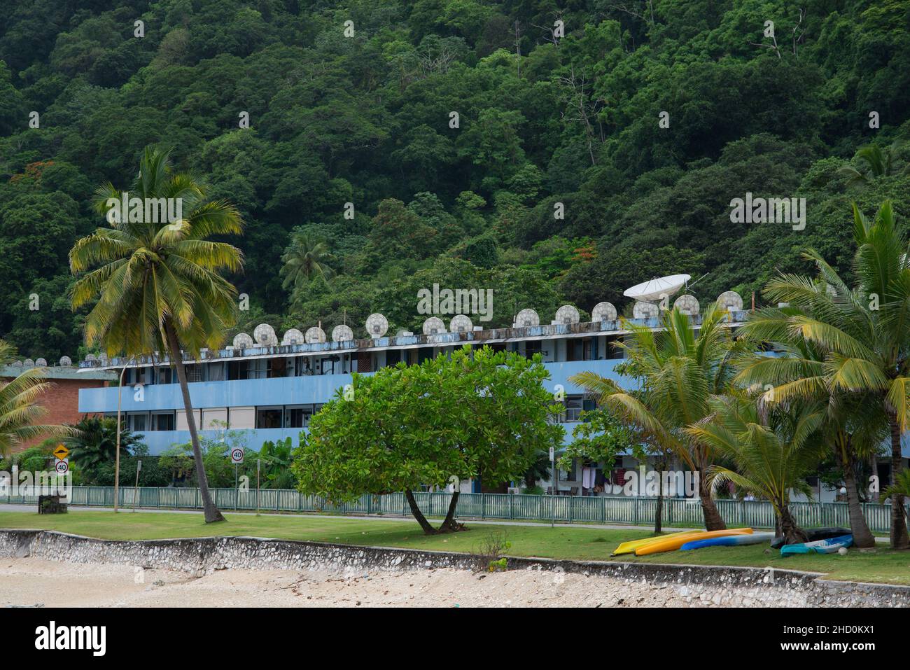 Satellite dishes adorn the roof of an apartment building in the kompongs of Flying Fish Cove on Christmas Island. Stock Photo