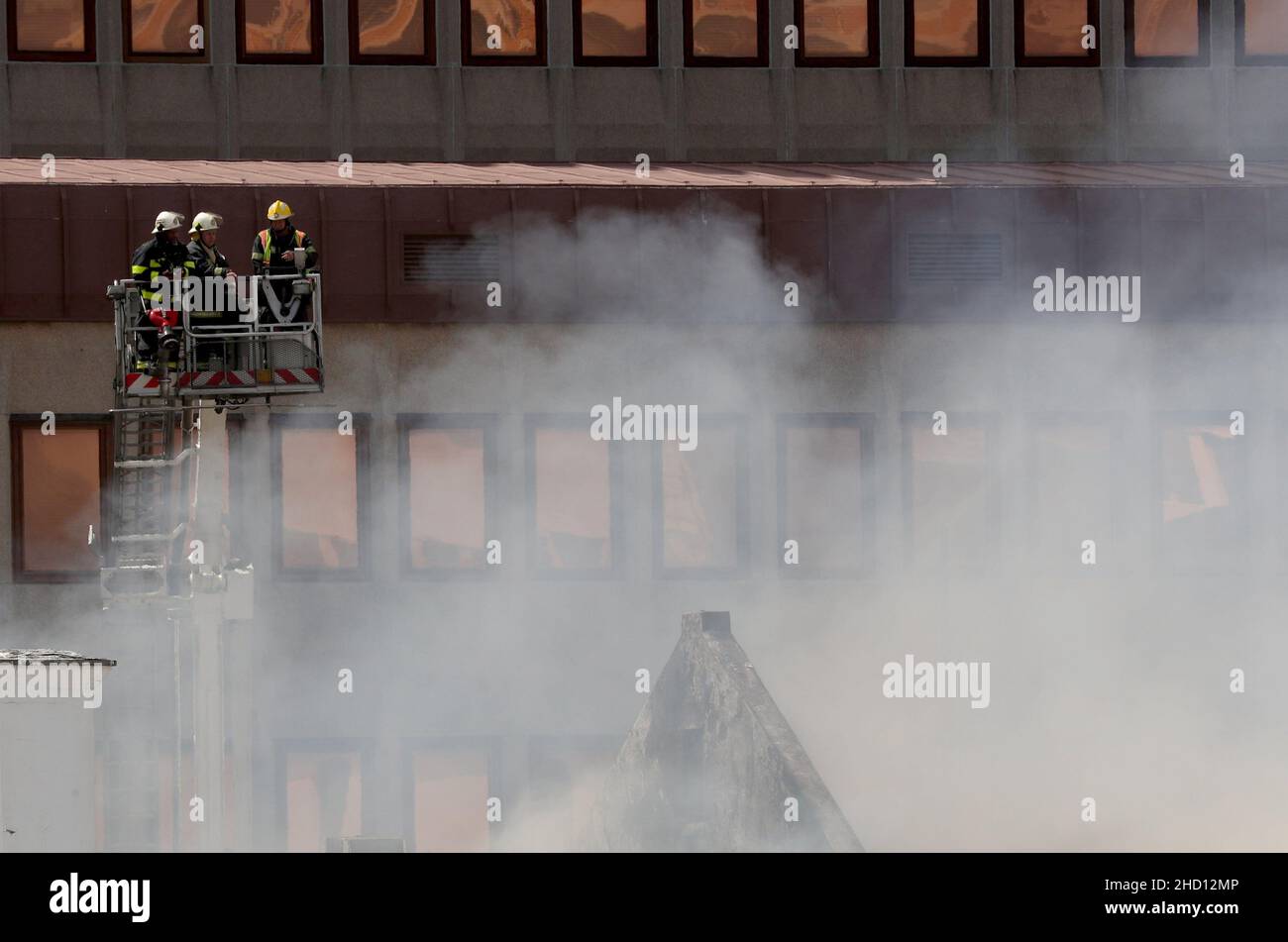 Firemen surgery the damage after a fire broke out at parliament in Cape Town, South Africa, January 2, 2022. REUTERS/Mike Hutchings Stock Photo