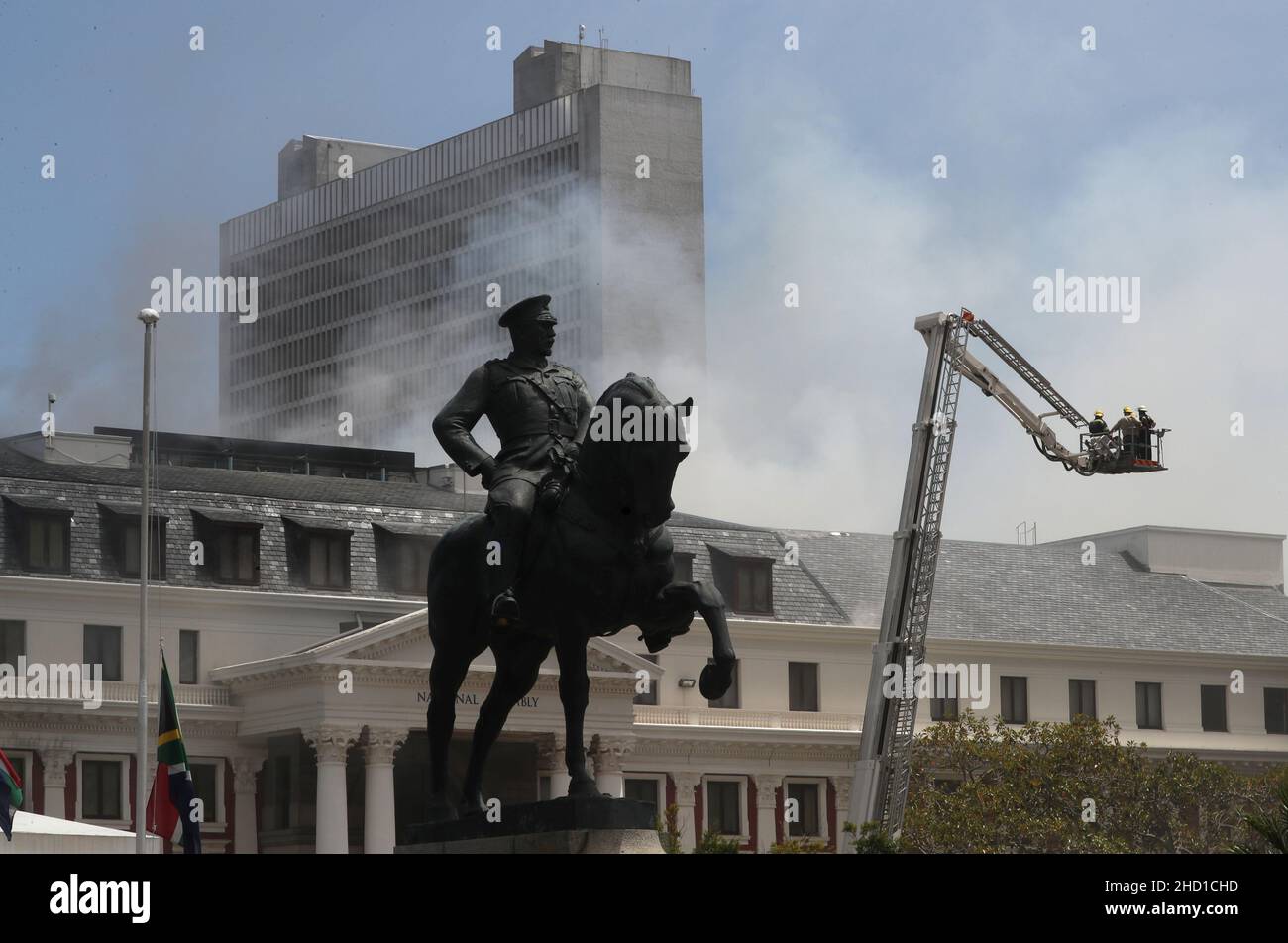 The statue of Louis Botha, former prime minister of the union of South Africa, is seen in front of the parliament where a fire broke out in Cape Town, South Africa, January 2, 2022. REUTERS/Mike Hutchings Stock Photo