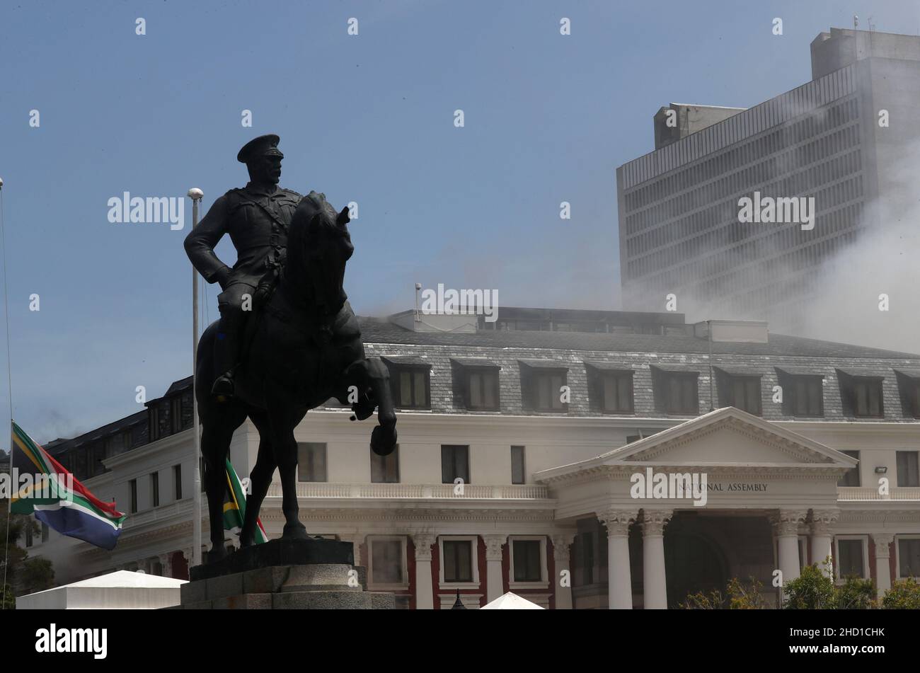 The statue of Louis Botha, former prime minister of the union of South Africa, is seen in front of the parliament where a fire broke out in Cape Town, South Africa, January 2, 2022. REUTERS/Mike Hutchings Stock Photo