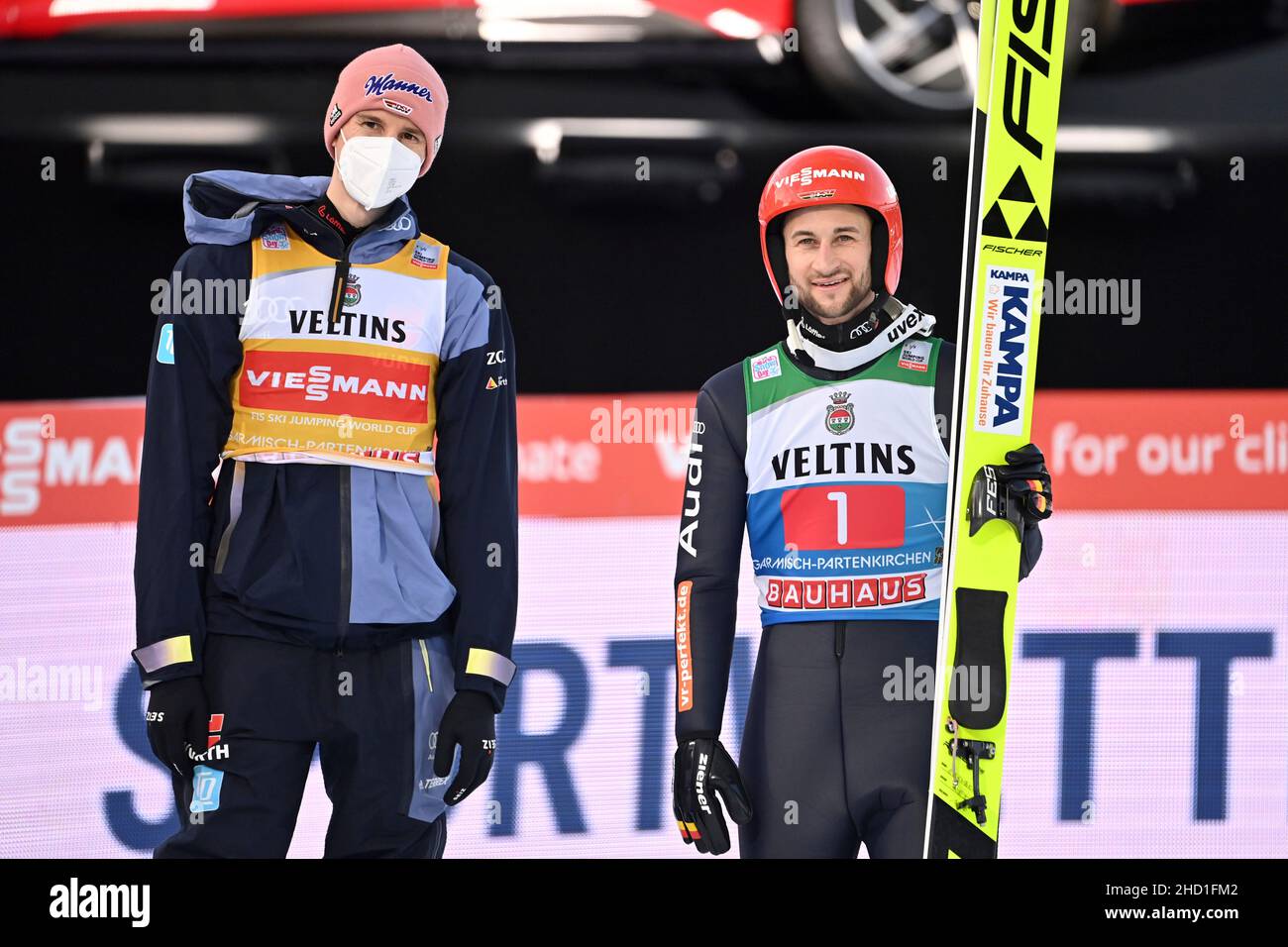 from right: Markus EISENBICHLER (GER), Karl GEIGER (GER) in the ski jumping area. Ski jumping, 70th International Four Hills Tournament 2021/22, New Year’s jumping in Garmisch Partenkirchen Olympic hill on January 1st, 2022 Stock Photo