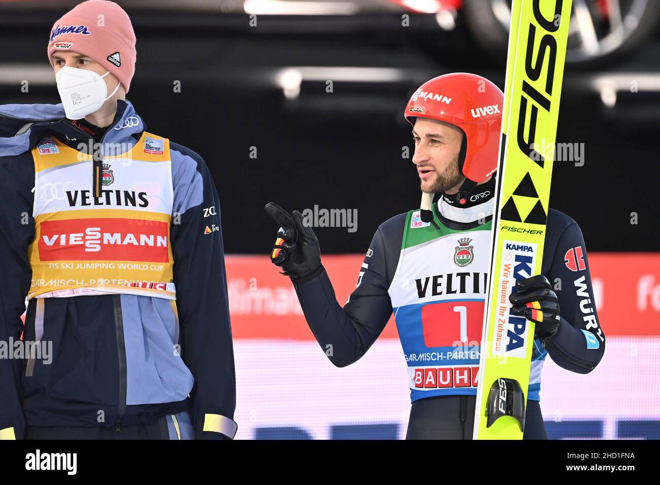 from right: Markus EISENBICHLER (GER), Karl GEIGER (GER) in the ski jumping area. gesture, ski jumping, 70th International Four Hills Tournament 2021/22, New Year's jump in Garmisch Partenkirchen, Olympic hill on January 1st, 2022 Stock Photo