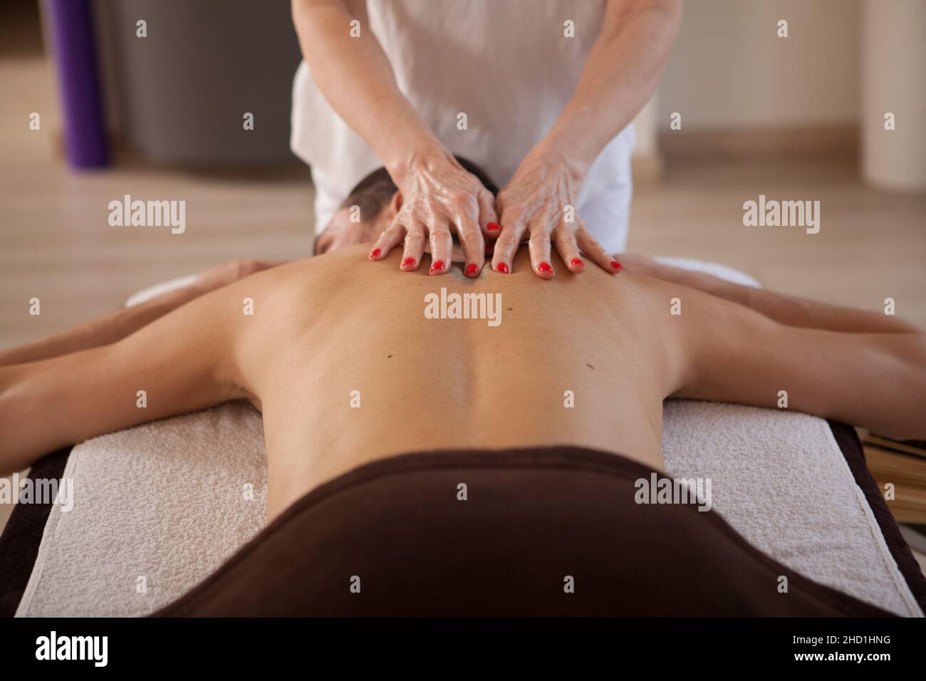 Male client getting professional back massage at spa center Stock Photo